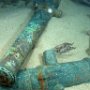 A bronze cannon with a wooden tampion still sealing the bore in Area A of the wreck of the first-rate warship HMS Victory.